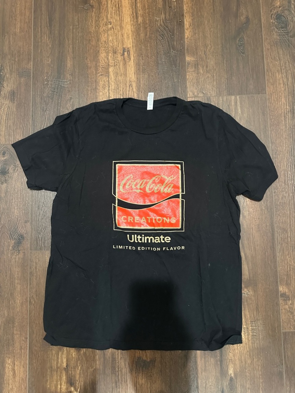 Coca Cola Black Tee with Red Logo and Gold Accents